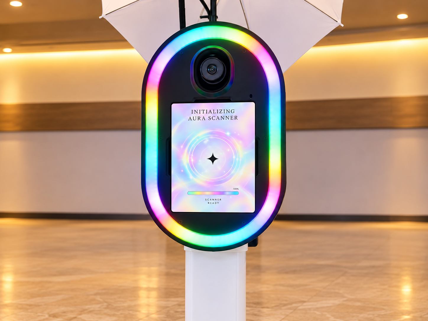 Aura Booth photo station with a rainbow light ring, camera and colorful portrait display
