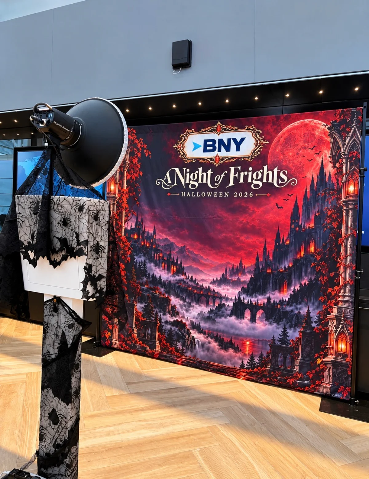 The decorated BNY photo booth with lighting and the custom A Night of Frights backdrop
