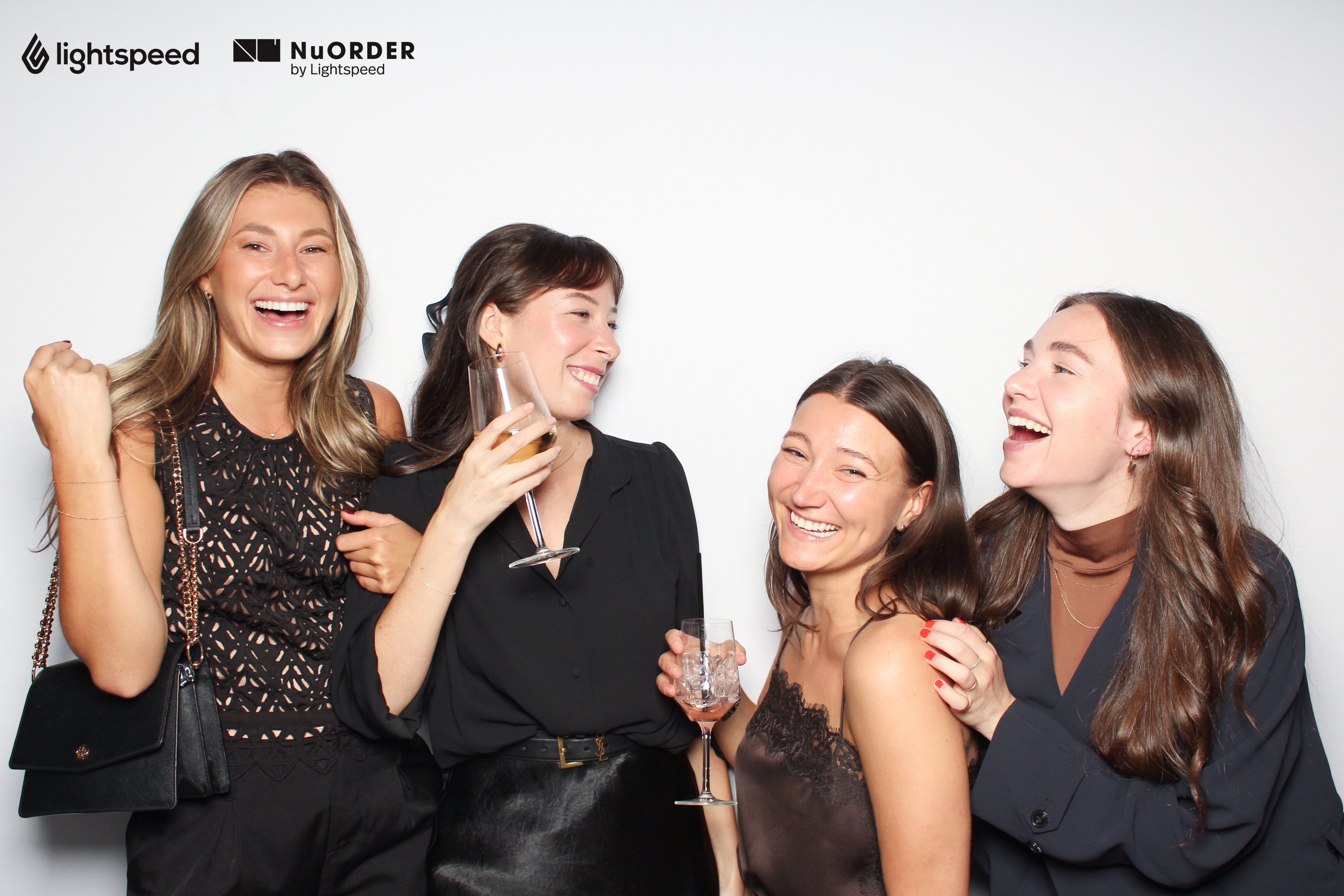 Corporate event guests laughing at a Snaptrend photo booth
