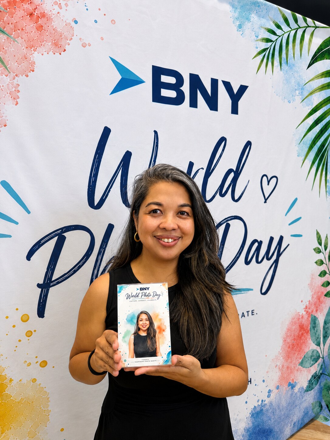 A guest with her finished watercolor portrait