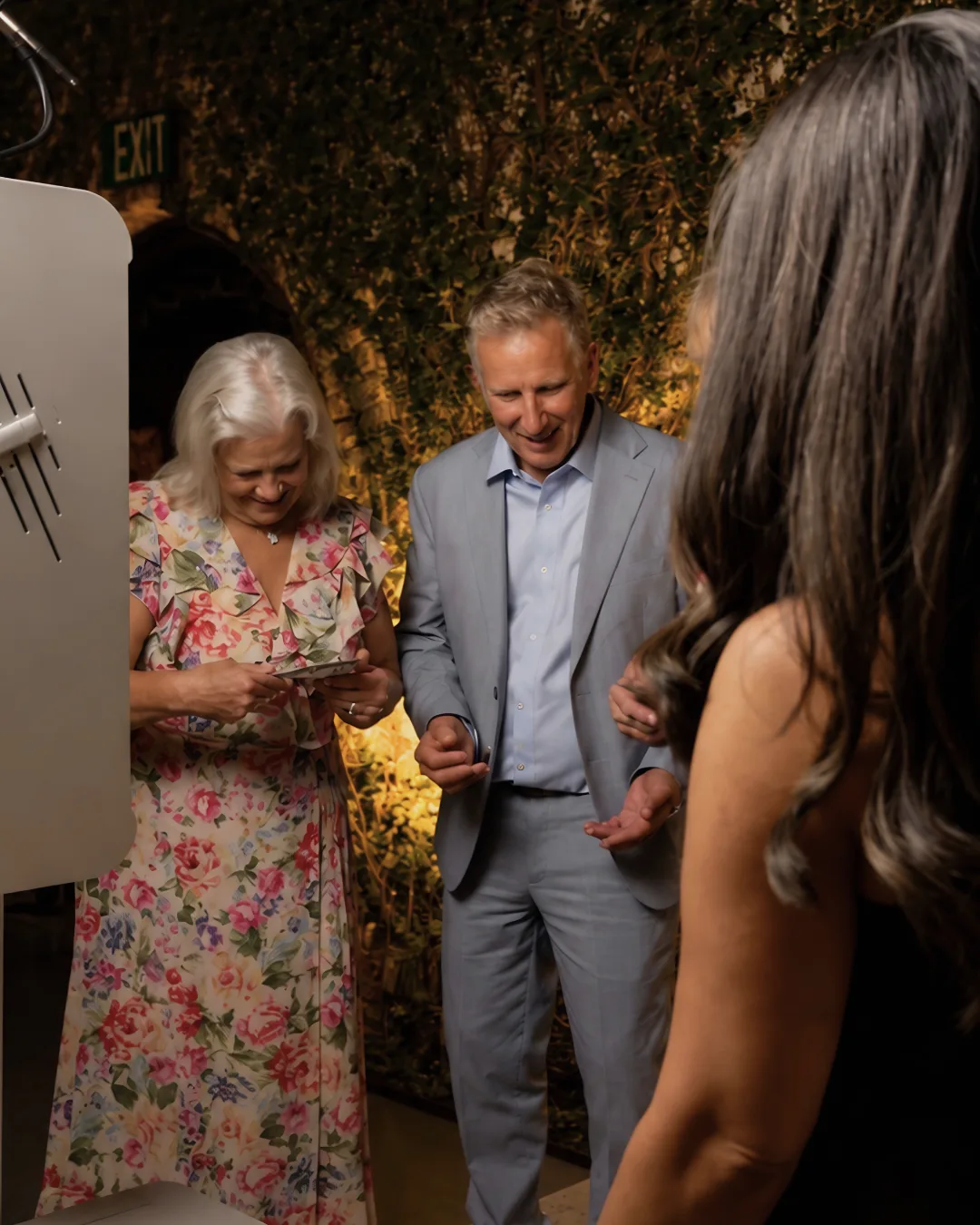 Guests review a photo at the booth