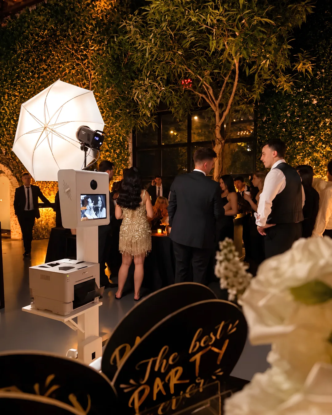 The Glam Booth and umbrella light set up among guests at The Foundry