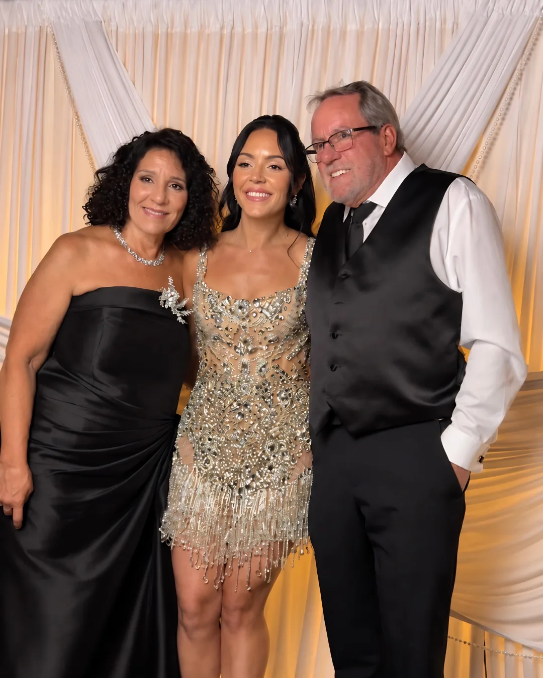 Three guests pose together for a portrait