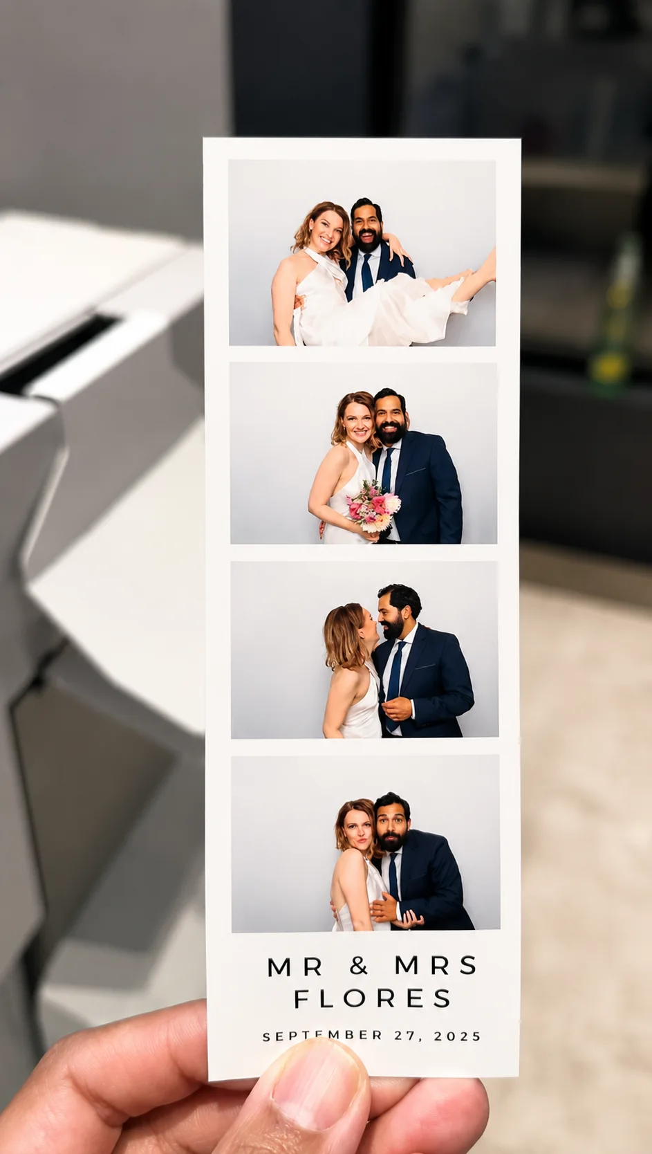 Hand holding a custom four-frame wedding photo strip with couple portraits, names, and a date