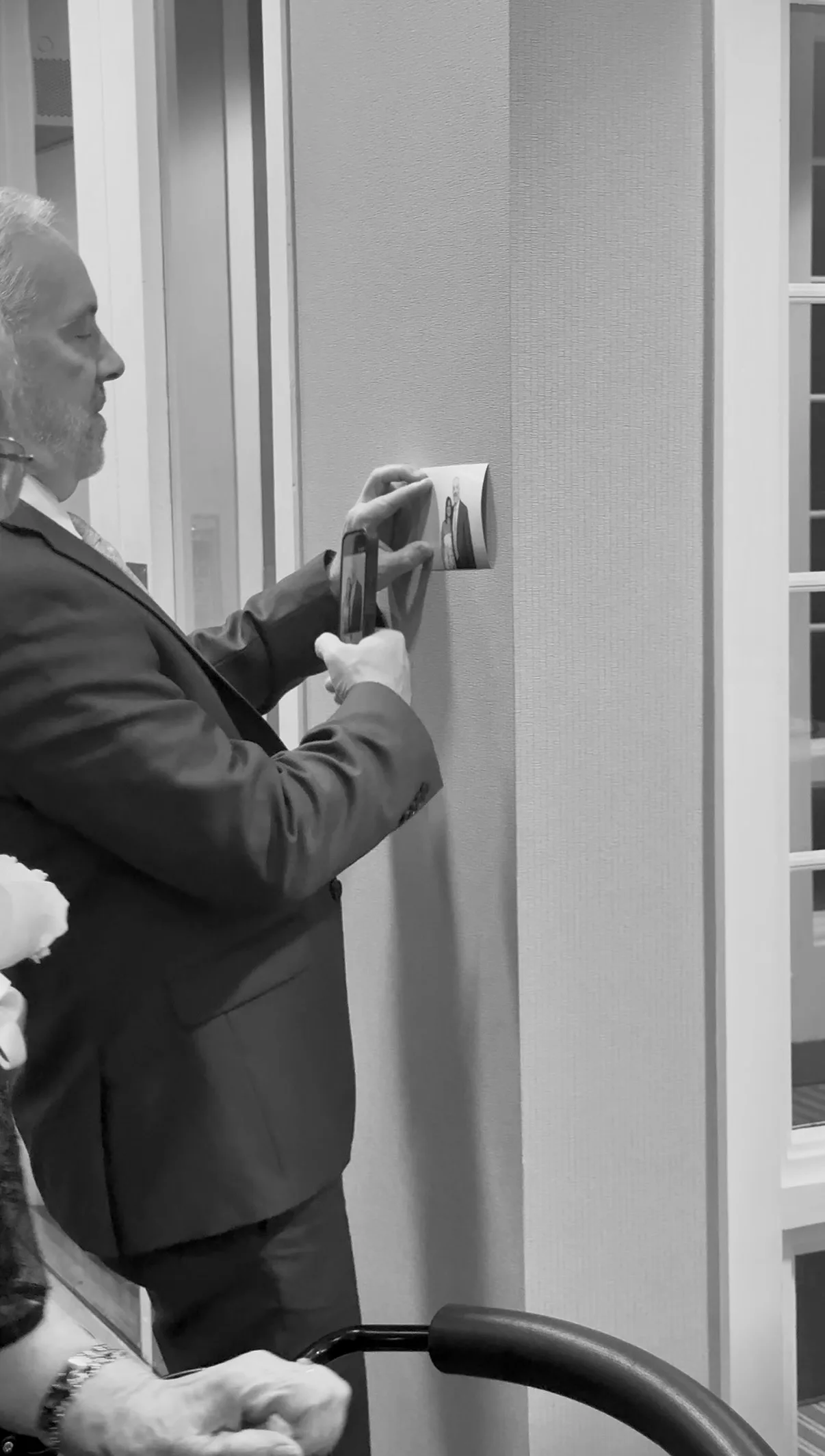 A guest photographs a moment beside the booth
