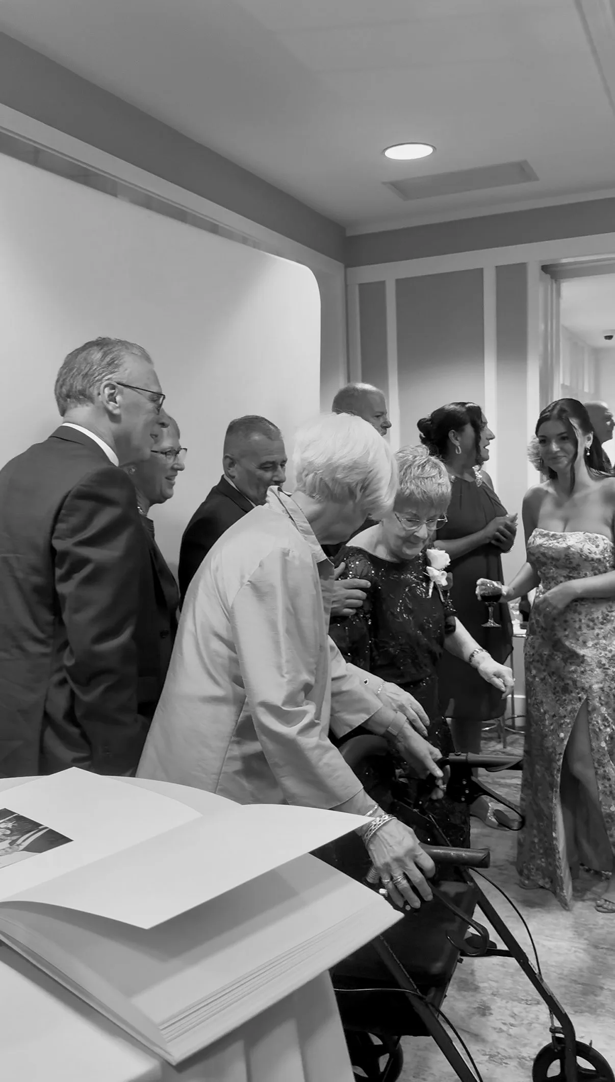 Guests gather around the booth print station