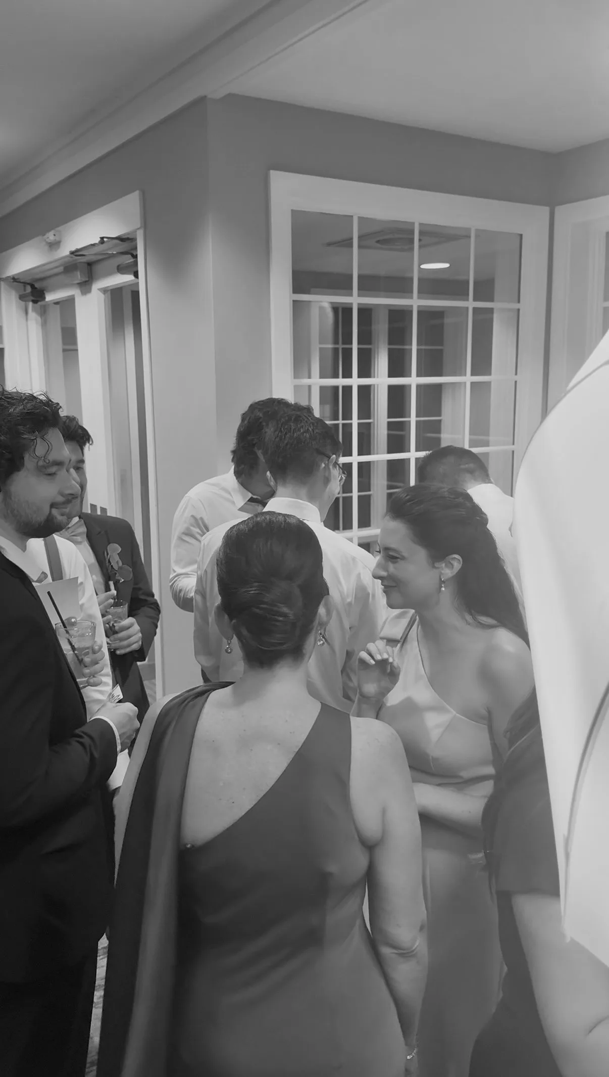 Guests gather beside the booth for another photo