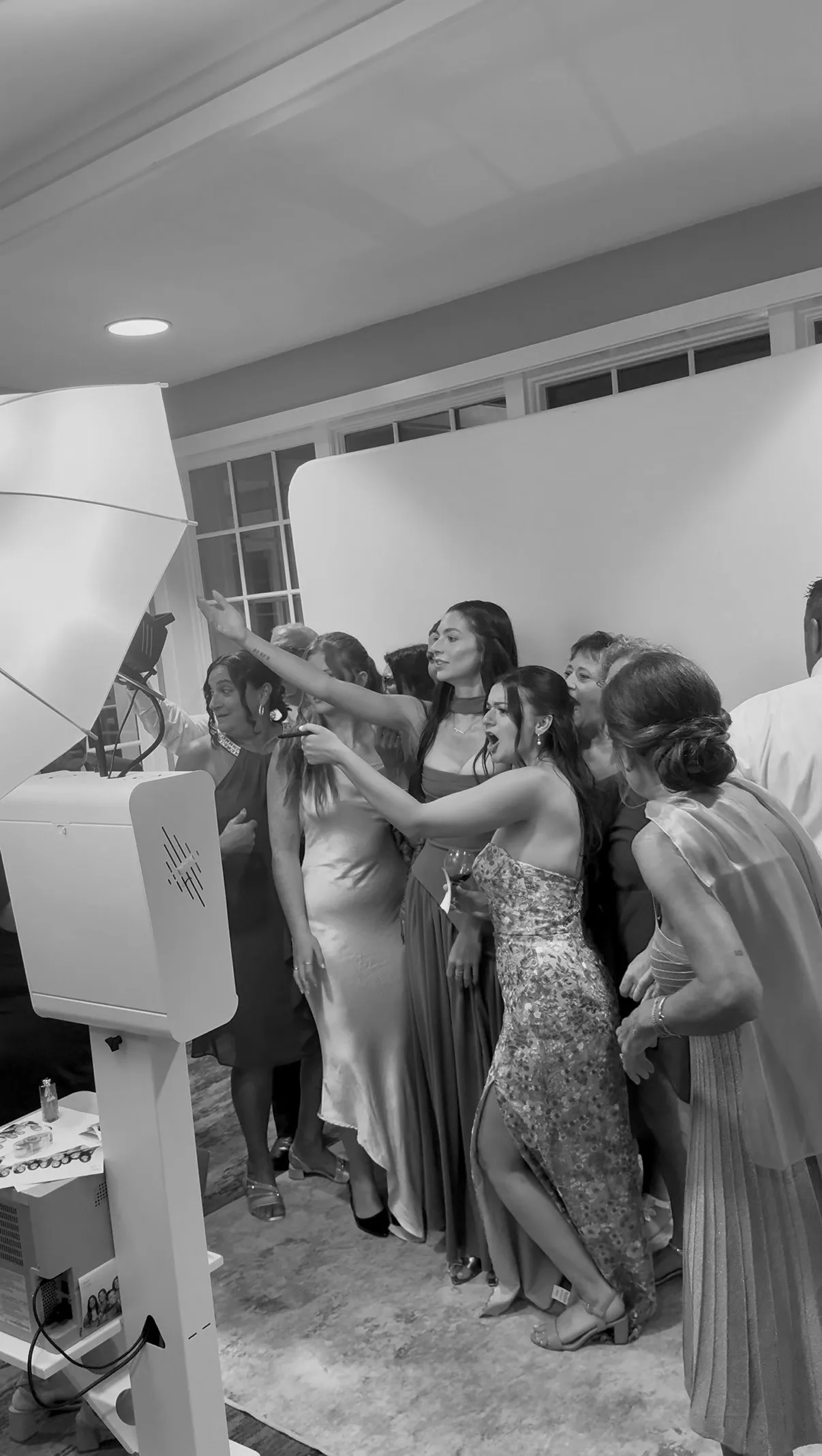 Guests lean together for a lively group photo