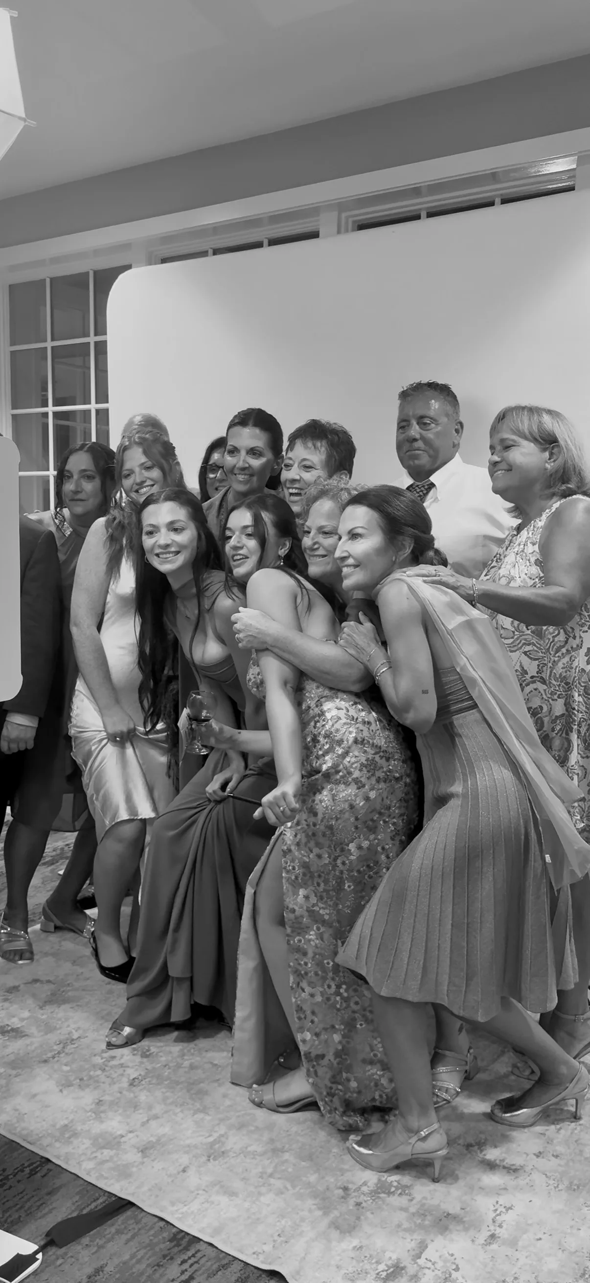 Guests crowd together for a wide group portrait