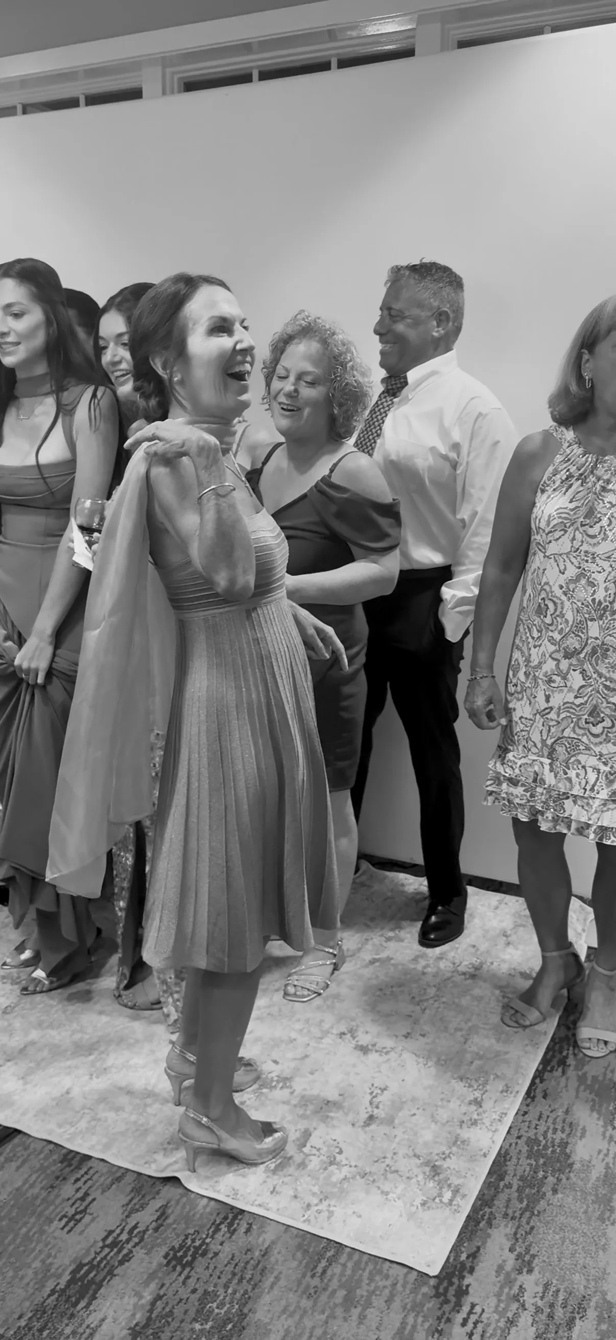 Guests share a moment between photo booth poses