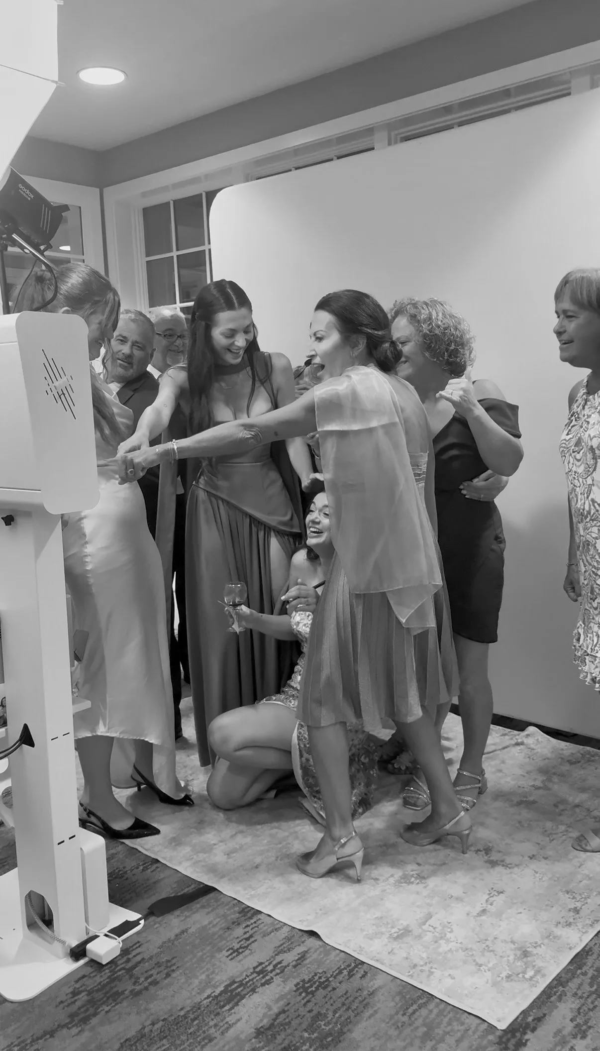A group of guests adjust their pose for the camera