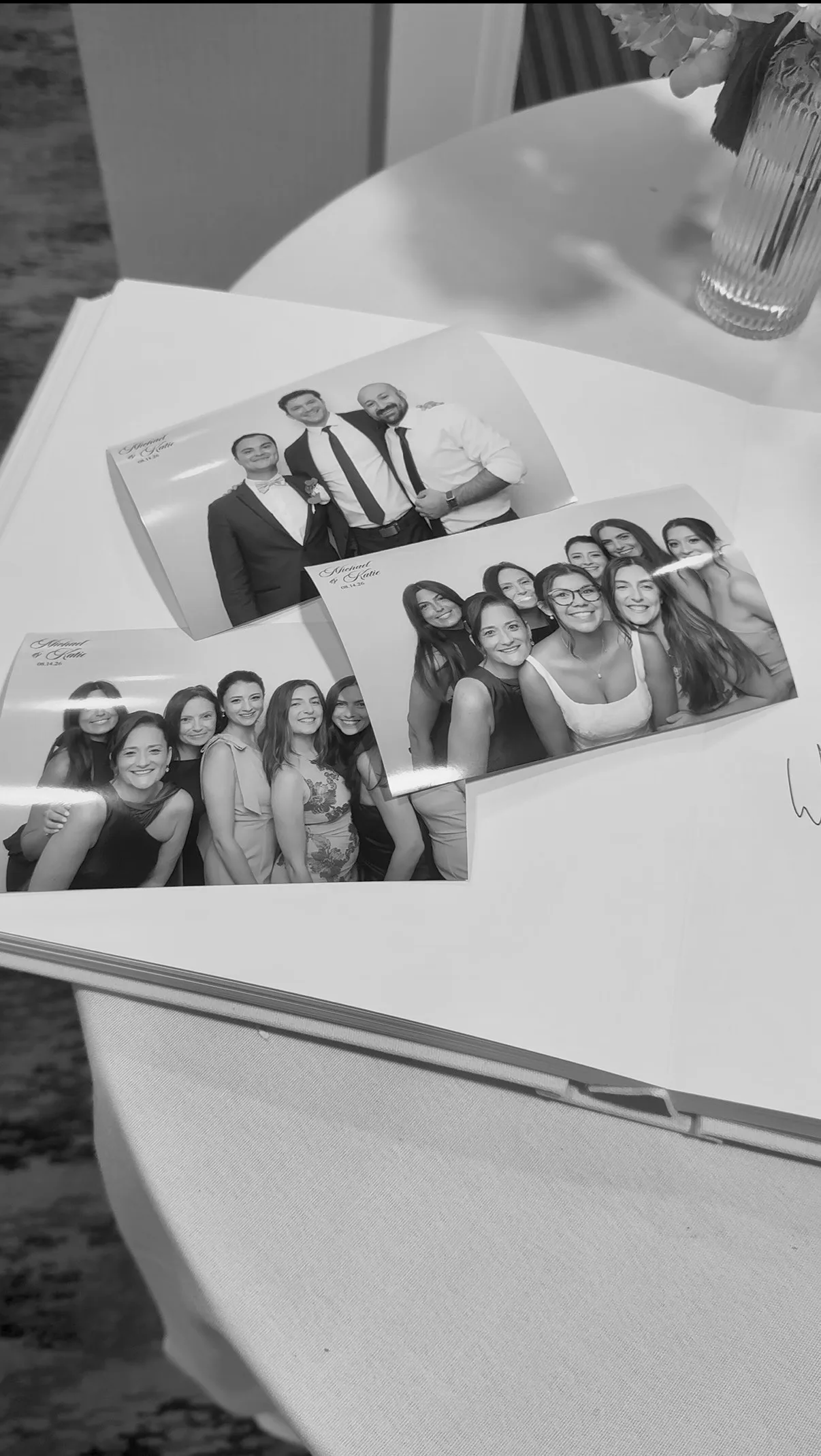 Printed photo booth portraits displayed on a table