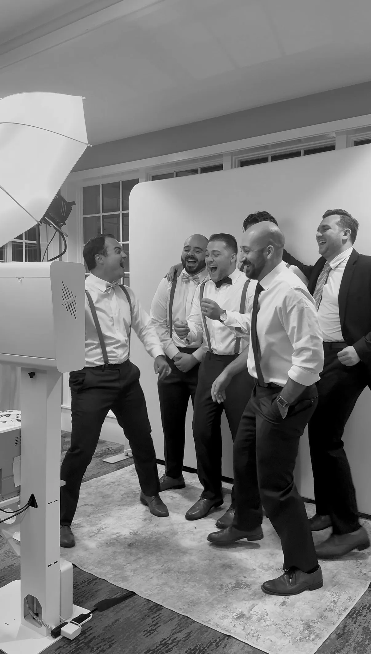 Wedding guests gather for another black-and-white portrait