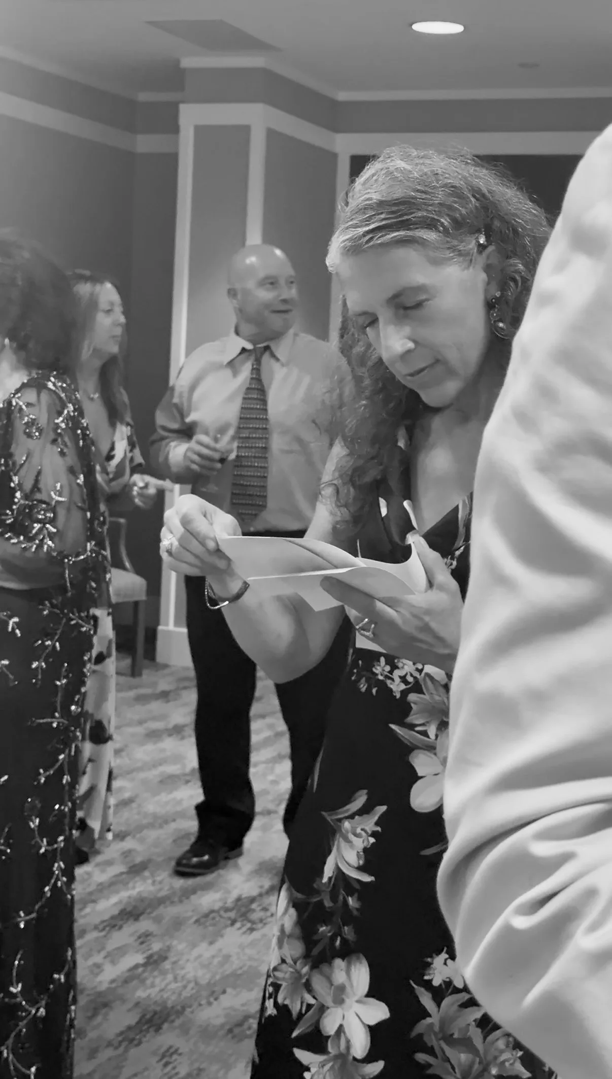 A guest looks at a freshly printed photo