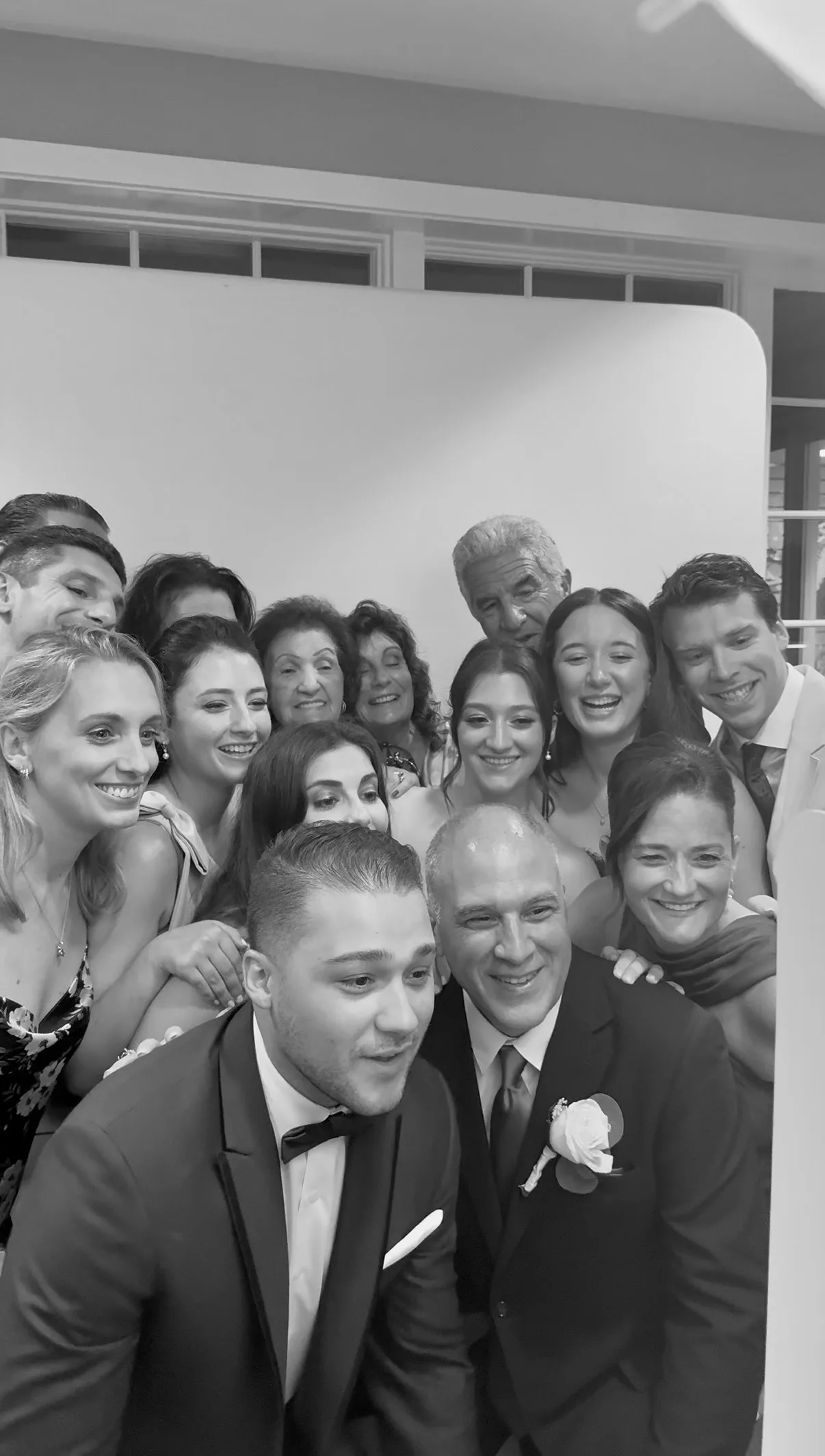 Family and friends crowd into the Glam Booth portrait