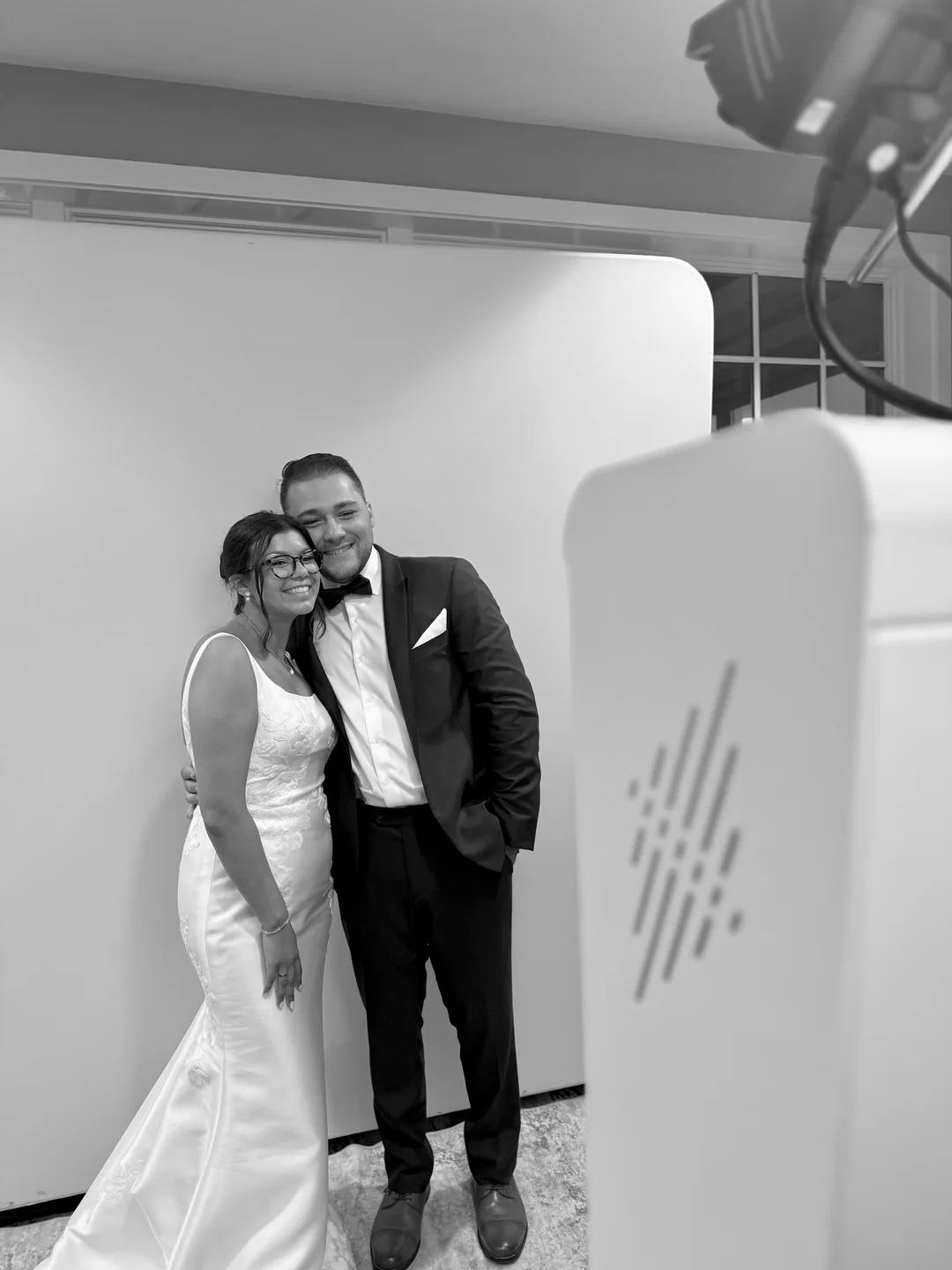 Katie and Mike together beside the Glam Booth at their wedding
